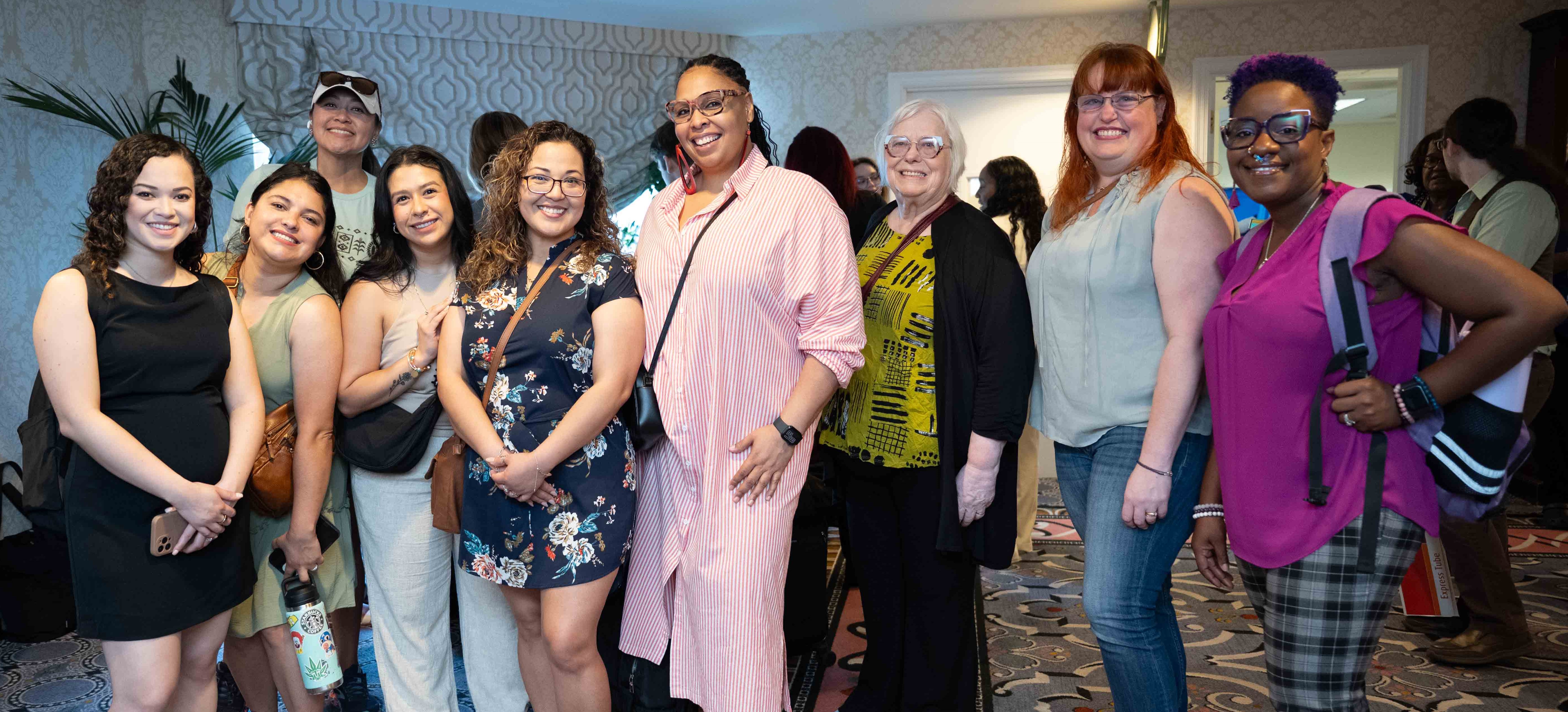 Several NASW conference attendees smiling for the photographer